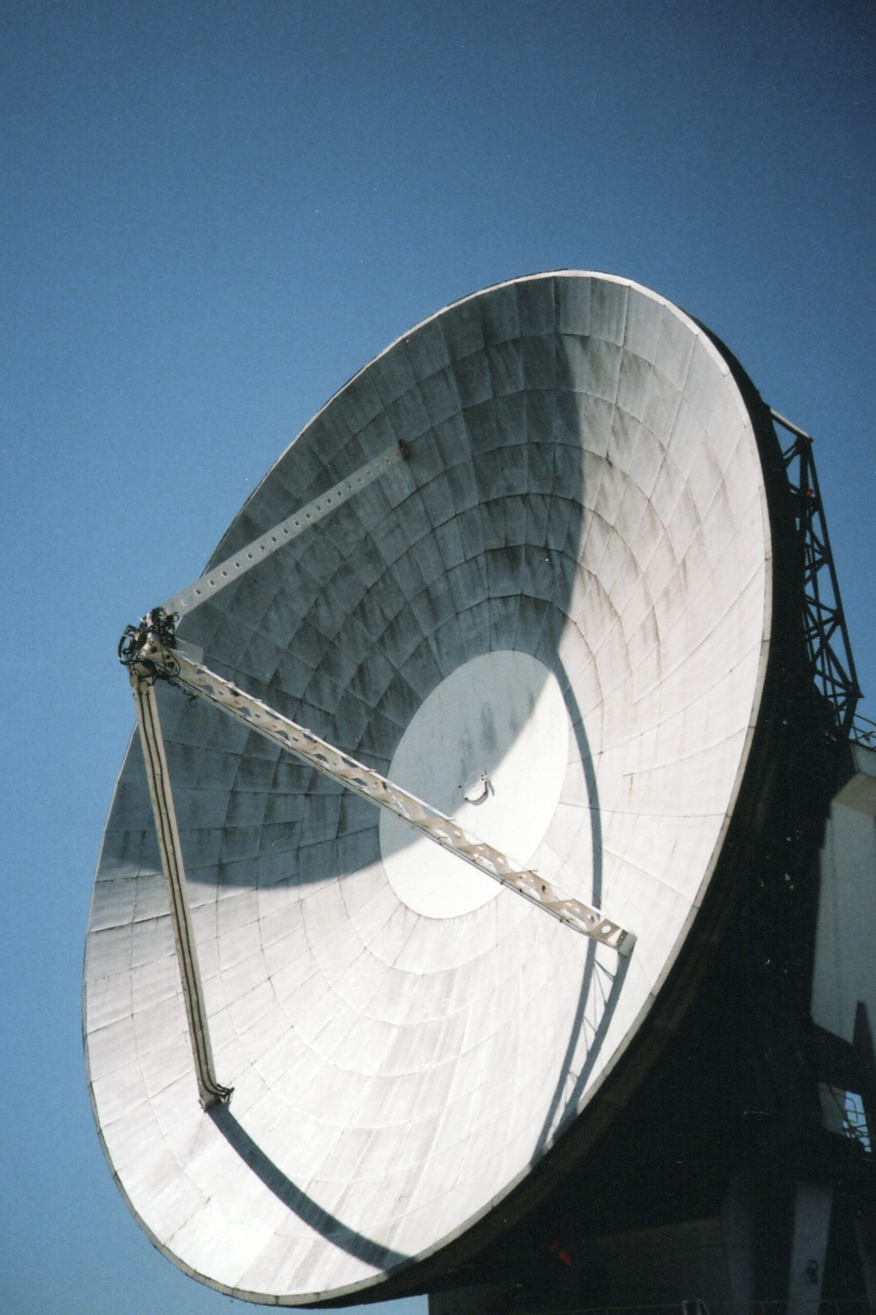 Large satellite dish antenna at a ground receiving station, illustrating how satellite data would be received